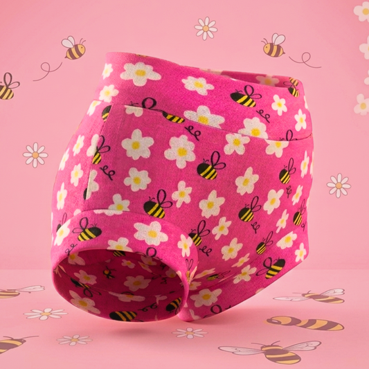 Pink underwear with floral and bee pattern on a pink background with similar design elements.