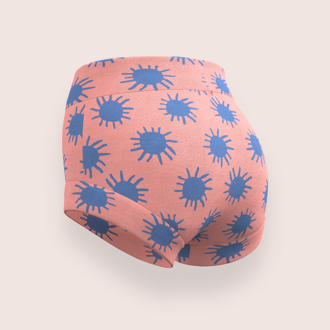 Girls underwear brief in coral with blue suns