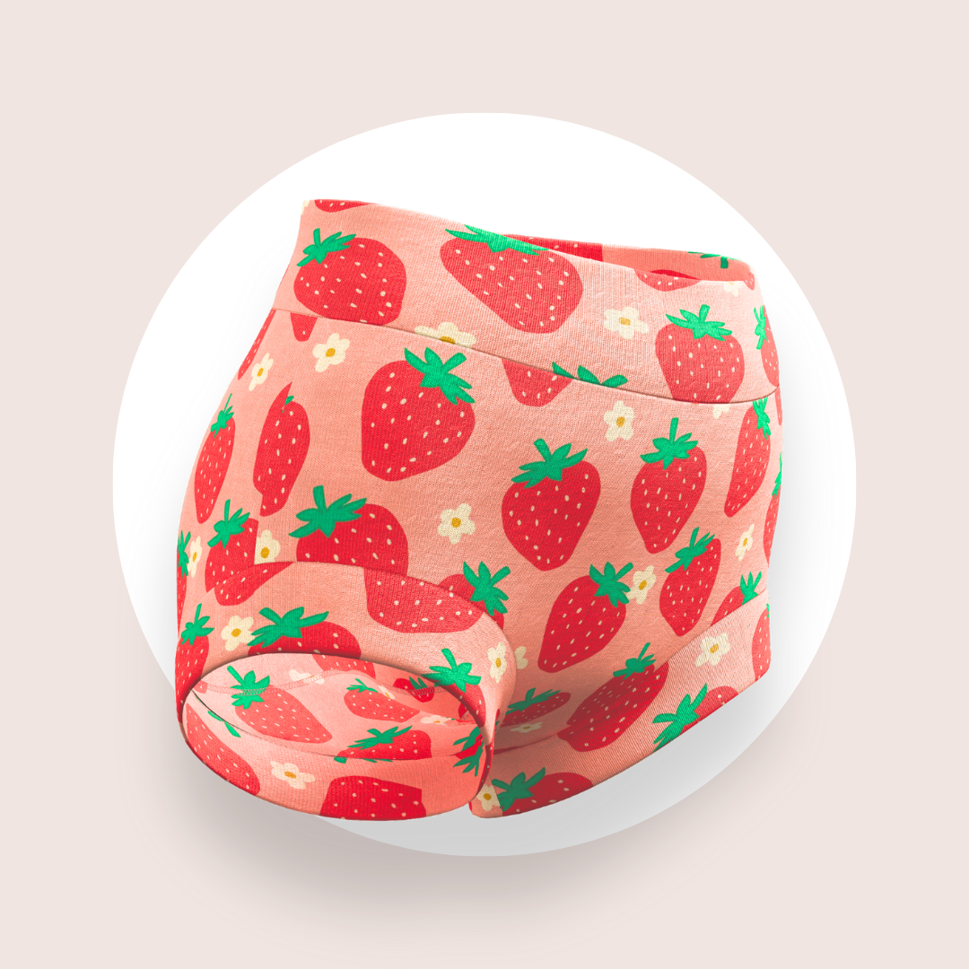 Strawberry-patterned girls briefs on a pink background